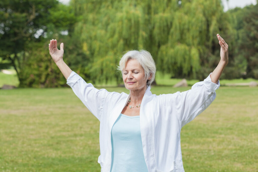 Older Woman Practicing Yoga Outdoors