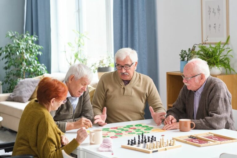 Group of older adults playing together at a table