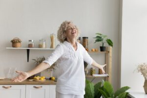 Joyful senior woman at home.